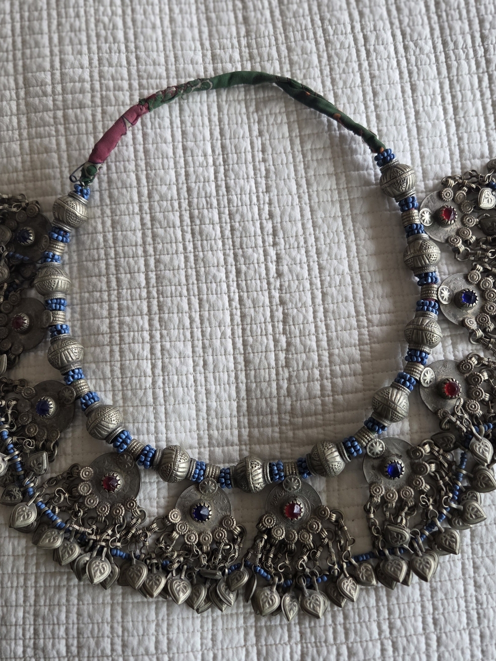 Handcrafted Silver-Tone Tribal Necklace with Blue Beads and Multi-Charm Fringe